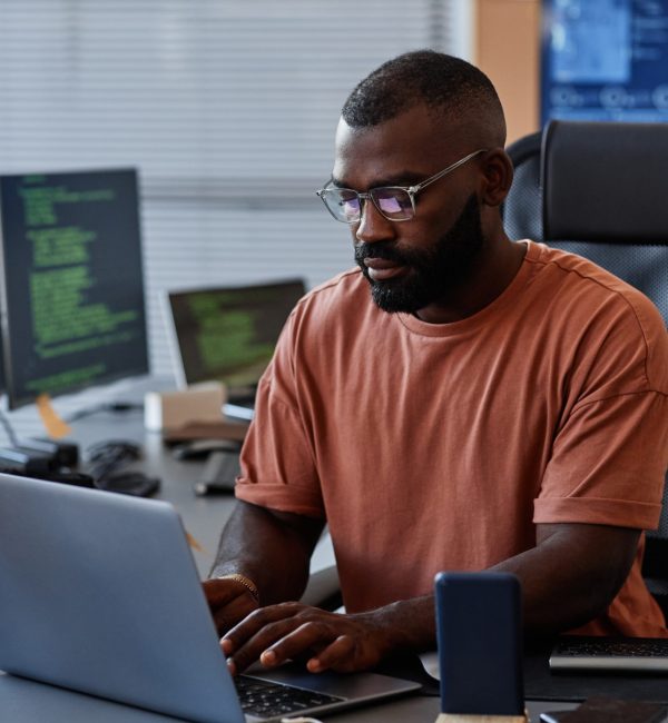 portrait-black-software-engineer-using-computer-high-technology-office-data-systems-progra-scaled